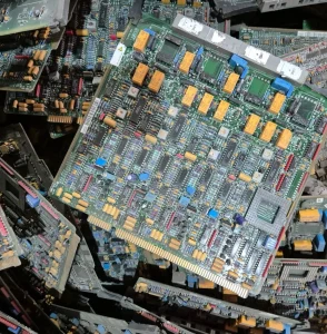 Stack of populated printed circuit boards ready for recycling